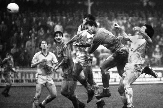 Wigan Athletic centre-forward Steve Johnson gets a header on target watched by Graham Barrow in the Division 3 match against Preston North End at Springfield Park on Saturday 29th of December 1984.
Latics won 2-0 with Steve Johnson and David Lowe scoring.