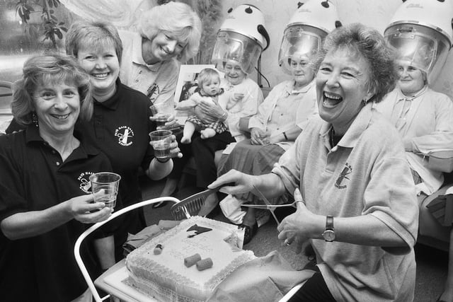 Cutting her cake to celebrate 40 years in the hairdressing business is 61 year old Pat Kenyon of Kenyon's Hairdressers, High Street, Standish, on Friday 17th of November 1995.