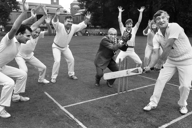Wigan MP Roger Stott looks stumped by Wigan Mayor, Coun. Ronald McAllister, at the launch of Wigan Cricket Festival on the Mesnes Playing Field on Saturday 1st of September 1990.