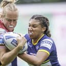 Wigan's Anna Davies is tackled by Leeds's Sophie Robinson