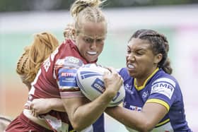 Wigan's Anna Davies is tackled by Leeds's Sophie Robinson