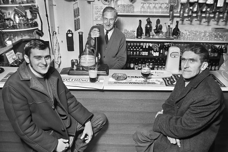 Tontine's Delph Tavern landlord, John Curtis, with customers, Tony Wilkinson and Thomas Glover, in March 1972.