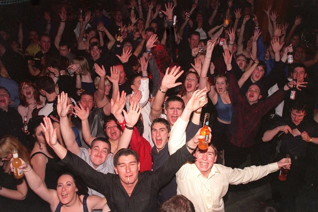 New Year revellers at Chicago Rock Cafe in Wigan join in the celebrations of the Millennium on the dance floor.