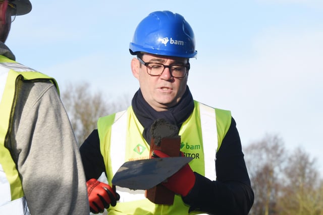 The Mayor of Greater Manchester Andy Burnham, laid a brick and signed steel on the building, along with staff and pupils from the school.