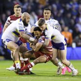 Wigan Warriors take on Warrington Wolves on Sunday afternoon