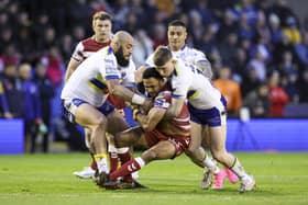 Wigan Warriors take on Warrington Wolves on Sunday afternoon