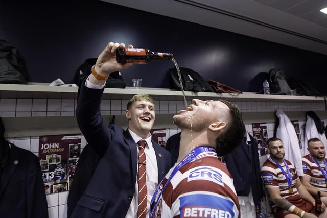 Cade Cust celebrates in the changing rooms after victory against Huddersfield