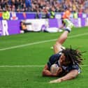 England’s Dom Young scores a try against PNG at the DW Stadium in the World Cup quarter-finals