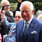 Prince Charles meets the crowds of people outside The Old Courts, Wigan - HRH Prince Charles visits Wigan Little Theatre as well as Uncle Joe's Mint Ball factory and The Old Courts, Wigan, April 2019.