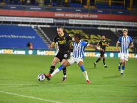 Will Keane in action for Latics at Huddersfield
