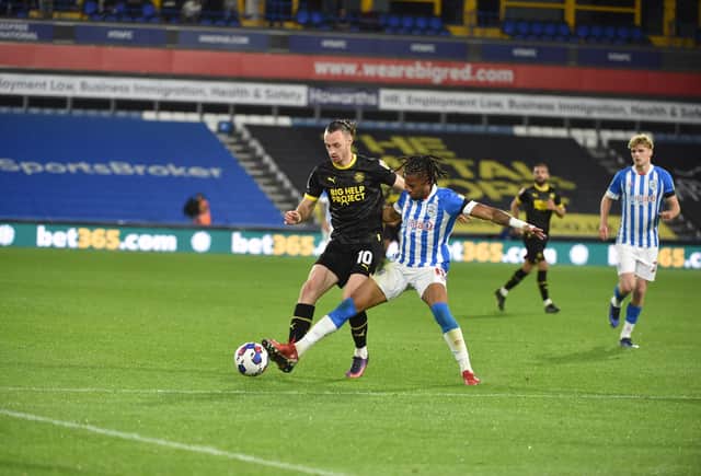 Will Keane in action for Latics at Huddersfield