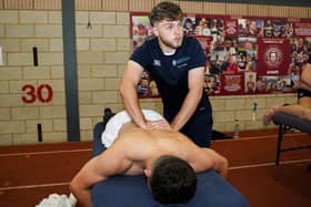 Jake Dunnell with Wigan Warriors player Tom Forber