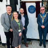 The blue plaque is unveiled at Real Crafty on Upper Dicconson Street