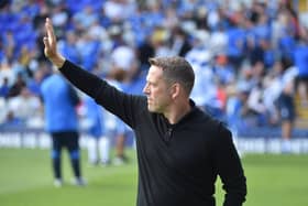 Leam Richardson salutes the travelling Latics support at Birmingham