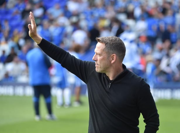 Leam Richardson salutes the travelling Latics support at Birmingham