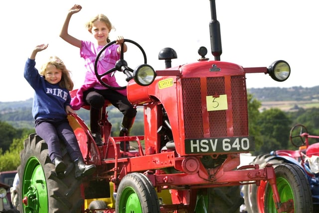 On the tractor trail are Leanne and Chloe Ashcroft with a BMB President model at the Haigh Steam and Vintage Rally on Sunday 25th of August 2002.