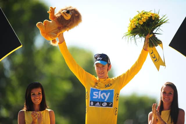 Great Britain's Bradley Wiggins of Sky Pro Racing celebrates on the winners podium after winning the 2012 Tour de France. PA Wire