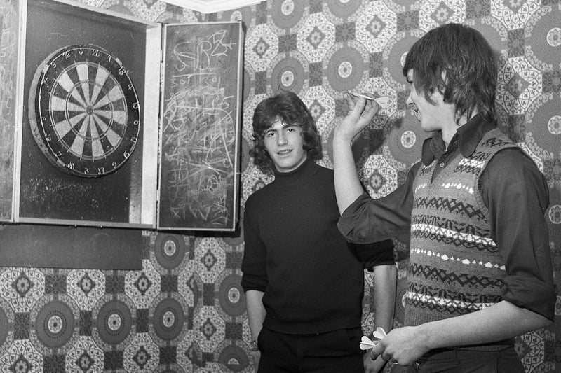 A darts match between John Causey, left, aged 17 and Charles Briggs, 16, at Sacred Heart Youth Club on Tuesday 17th of October 1972.