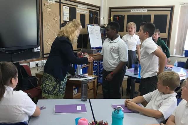 The children receiving their badges