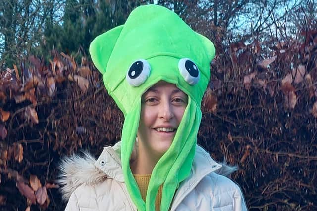 Green squid hat.