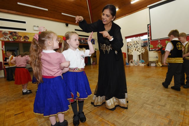 Prags Birk, creative director of Cultural Education-Asians, with pupils at Aspull Church Primary School, to deliver Hinduism and Sikhism interactive workshops, with traditional dancing, dressing up, henna, artwork and a Sikh Gurudwara set up, to every year group in the school.