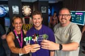 Lindsey Butler, from Wigan and Leigh Hospice, with Chris Connolly, chief executive of Connolly and Neil Gibson, operations manager