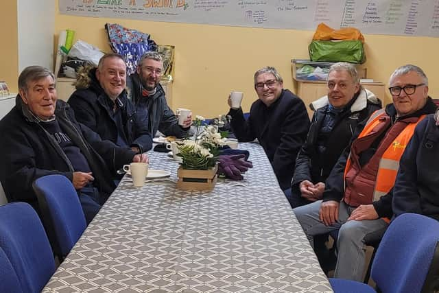 Committee members from FAWNS enjoy a hot drink after singing Christmas carols