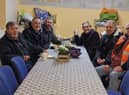 Committee members from FAWNS enjoy a hot drink after singing Christmas carols
