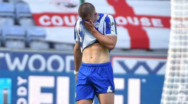 Charlie Hughes can't believe he has been sent off against Barnsley