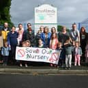 Parents, children and members of the community outside Brooklands Childcare, Garswood, which has announced it will close in a few weeks