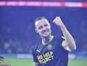Will Keane celebrates his last-gasp leveller at Cardiff in front of the away end