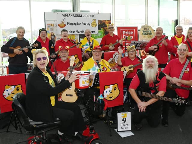 Wigan Ukulele Club members are playing for Pudsey