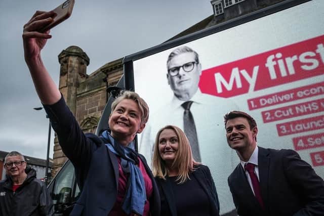 Labour's Shadow Home Secretary Yvette Cooper takes a selfie with newly-elected Labour MP for Bolton West Phil Brickell and Leigh and Atherton's Jo Platt