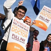 Flags and placards were waved by junior doctors on the picket line outside Wigan Infirmary last year