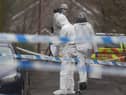 Forensic officers from Police Service of Northern Ireland (PSNI) at the sports complex in the Killyclogher Road area of Omagh