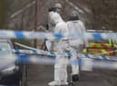 Forensic officers from Police Service of Northern Ireland (PSNI) at the sports complex in the Killyclogher Road area of Omagh