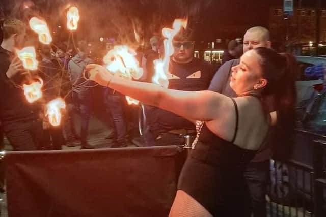 Fire eater performing outside Sky Lounge in Leigh on April 2