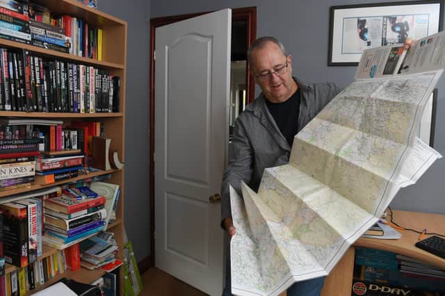 Author Nick Oldham using an OS map to make up new villages in Lancashire