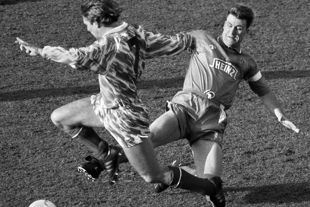 Wigan Athletic mid-fielder Kevin Langley with a lunging tackle against Brighton and Hove Albion in a 3rd division match at Springfield Park on Saturday 27th of February 1993.
Latics lost 1-2 with Peter Skipper getting their goal.