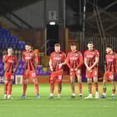 The Latics players ready themselves for the penalty shoot-out at Tranmere