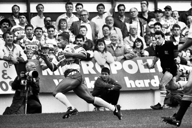 Wigan winger Jason Robinson races over for a try against Hull in a league match at Central Park on Sunday 29th of August 1993.
Wigan won the game 16-8.