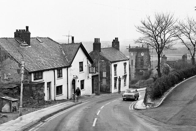 Alma Hill, Up Holland, with the Old Dog Inn prominent and Up Holland parish church, St. Thomas the Martyr, in the background in January 1972.
Notorious local highwayman, George Lyon, was born in Up Holland in 1761 and after his capture was executed at Lancaster Castle in 1815.
The landlord of the Old Dog Inn, Simon Washington, brought his body back from Lancaster in preparation for burial at St. Thomas the Martyr Church in Up Holland.
His body was laid out overnight in in the landlady's best parlour at the pub and afterwards his ghost was said to haunt the premises.
