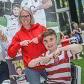 Grand Arcade's centre manager Mike Matthews and marketing executive Gill Sarath do the Joining Jack salute with Jack Johnson, right