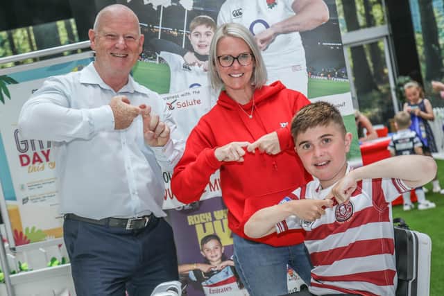 Grand Arcade's centre manager Mike Matthews and marketing executive Gill Sarath do the Joining Jack salute with Jack Johnson, right