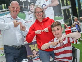 Grand Arcade's centre manager Mike Matthews and marketing executive Gill Sarath do the Joining Jack salute with Jack Johnson, right