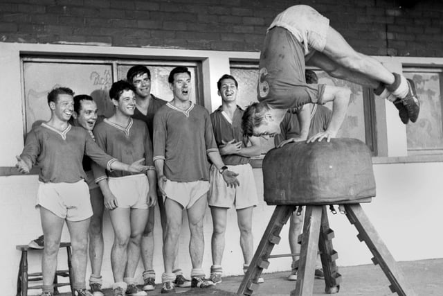 Legendary centre forward Harry Lyon leads the way for Wigan Athletic players gymnastic training at Springfield Park in the 1960s. 
