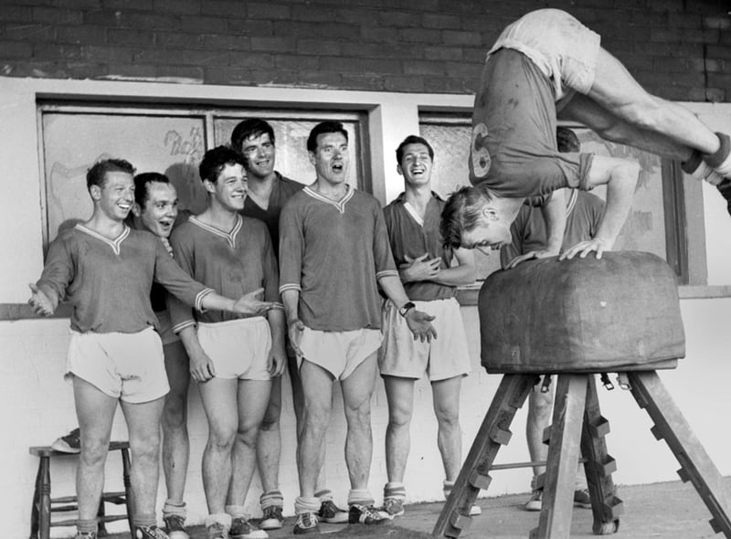 Legendary centre forward Harry Lyon leads the way for Wigan Athletic players gymnastic training at Springfield Park in the 1960s.