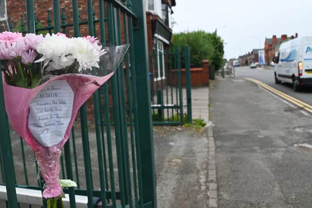 Some of the flowers left on Bolton Road, Ashton, in memory of Kathleen Kirby
