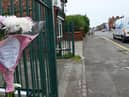 Some of the flowers left on Bolton Road, Ashton, in memory of Kathleen Kirby