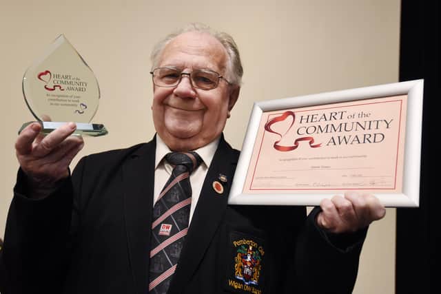 Derek Green with his award and certificate
